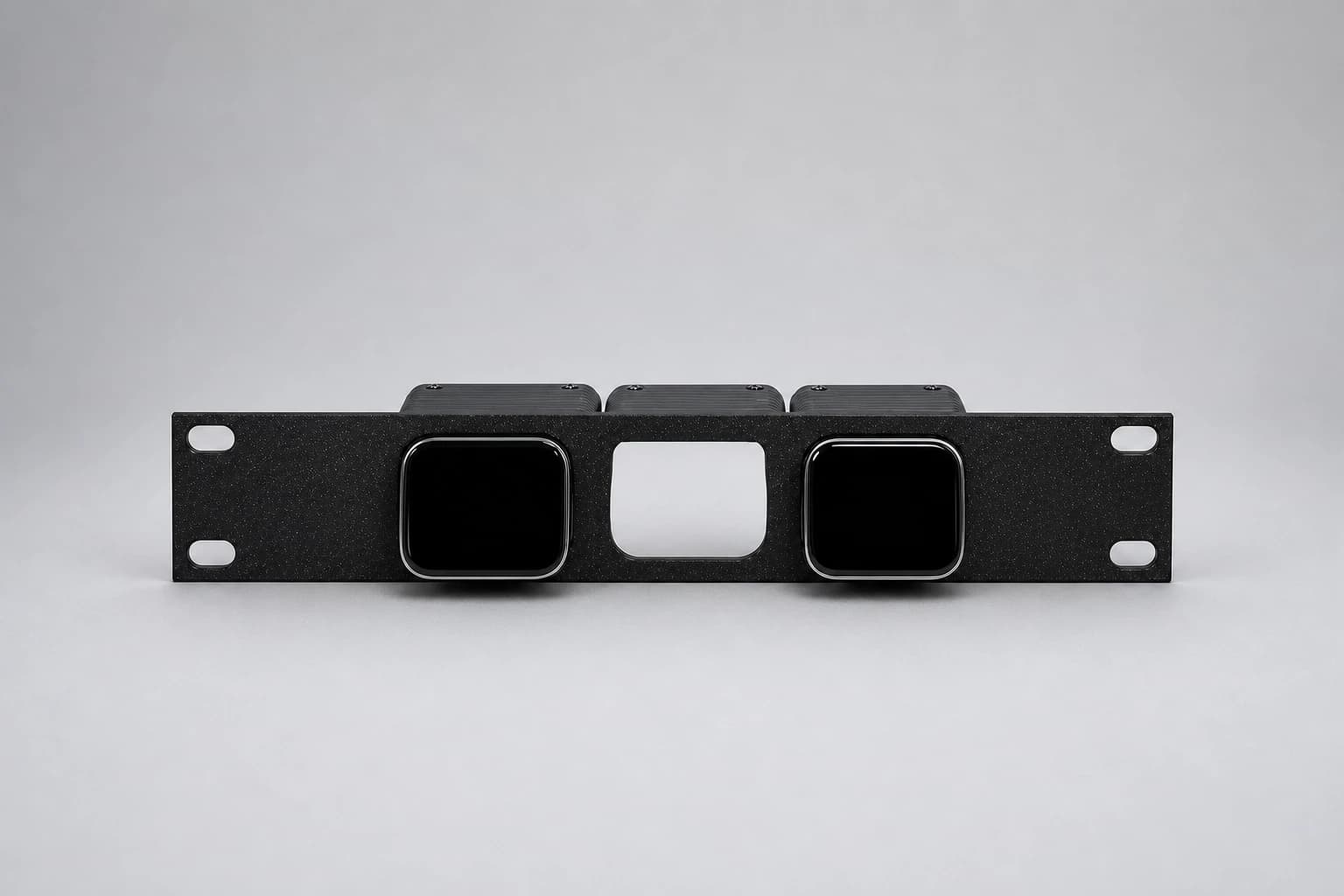Front studio view of the three-position JetKVM rack mount with two devices installed and the center position open