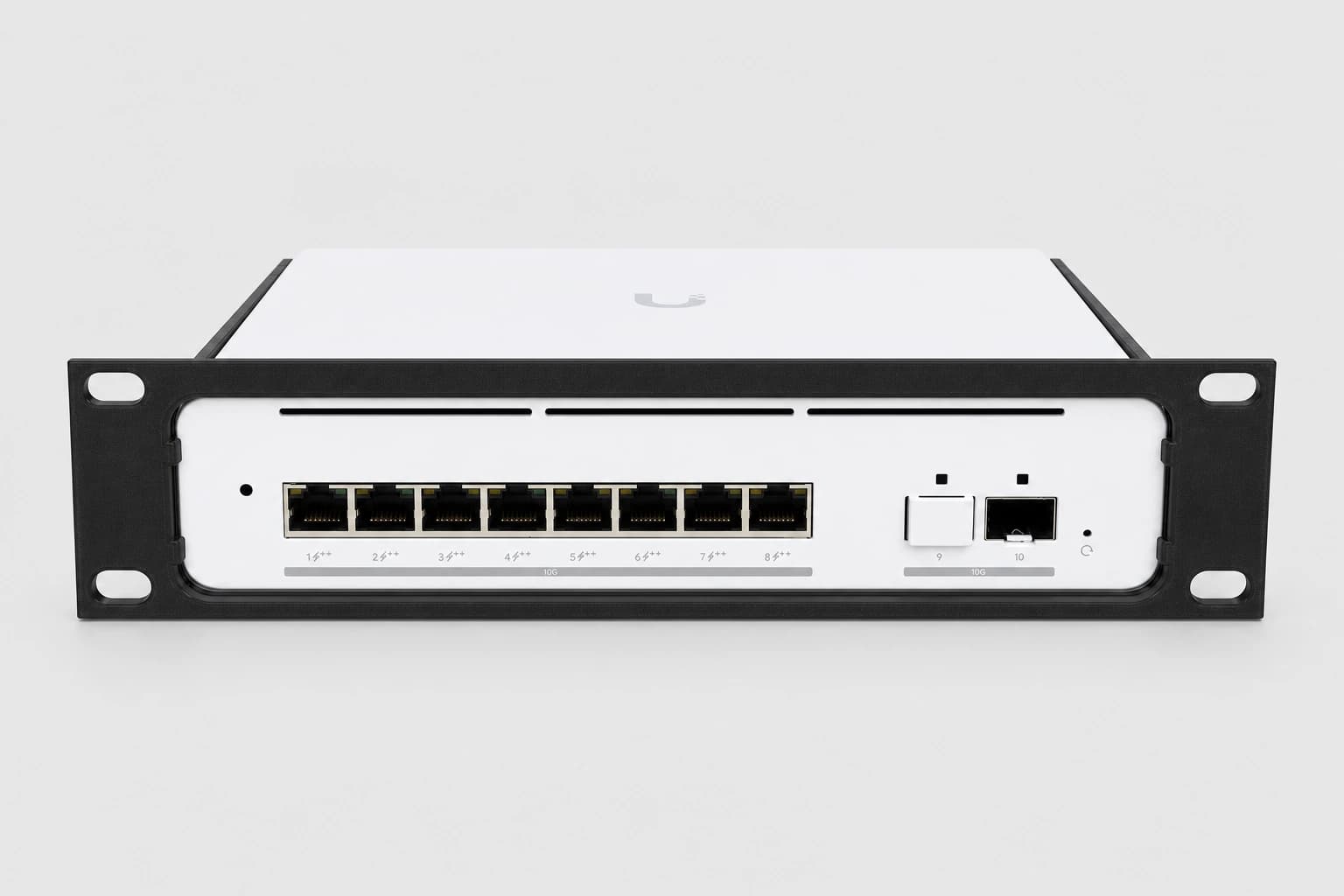 Front studio view of the UniFi Pro XG 8 PoE installed in the black 10-inch rack mount kit